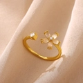 Detail of adjustable flower ring with opal petals and sparkling zircon on silk background - Gold White Flower MOP (G3014363)