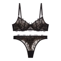 Detailed view of floral eyelash lace texture on a black underwired lingerie set - XL / Black + Thong
