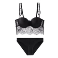 Detailed close-up of a black floral eyelash lace bralette set with matching panties - Black + Briefs / 80C