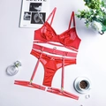 Detailed flat lay of red lace lingerie set with mesh bra and garter straps on white desk - S / Top And Bottom / Red