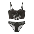 Detail of black satin and floral lace lingerie set with sheer mesh and thin straps - Black