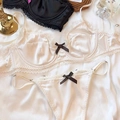 Light beige satin and lace lingerie set with heart patterns and black bows detail - M / Top And Bottom / White