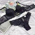 Detail of black lace bra and straps panty set with floral lace on silk background - 70A / Top And Bottom / Black