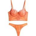 Orange lace lingerie set with floral embroidery and mesh details on white background - Orange