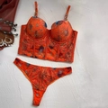 Detail of orange floral lace corset with metallic gold chain straps and structured boning - 70B / Top And Bottom / Orange