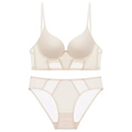 Detail view of seamless beige French U-back bra and matching mesh panty set on white - 70A Thick Cup / Nude