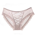 Close-up of lace panties with polka dot mesh and decorative criss-cross ribbon details - M / Dust Rose