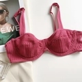 Detail of rose red mesh lace balconette bra styled with a fashion magazine and perfume - Rose Red