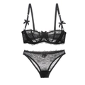 Completo intimo in pizzo nero con reggiseno trasparente e slip abbinati con fiocchi - 70A / Nero