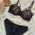 Sexy black caged lace lingerie set with strappy details and mesh panties flat lay - 70B / Top And Bottom / Black