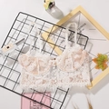 Elegante bralette in pizzo bianco con bottoni frontali e un raffinato stile vintage francese - S / Bianco