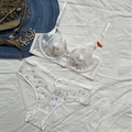 Set lingerie in pizzo bianco con ricami floreali, reggiseno in mesh e slip 75B - 70B / Bianco