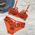 Completo intimo in pizzo arancione con ricami neri, comprensivo di reggiseno e slip - 70B / Arancione