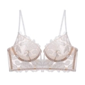 Detailed view of sheer floral embroidery lace and deep V-neckline on French style bra - S / Tops / White/Nude