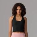 Black halter yoga tank top with integrated cups shown on model with pink leggings - Black