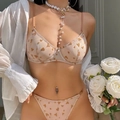 Nude mesh lingerie set with heart print and underwire bra on model - Brown