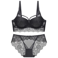 Detailed view of floral black lace bra and matching panty set on white background - 70B / Top And Bottom / Black