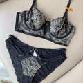 Sexy zwarte kanten lingerieset met grijs borduursel, beugelbeha en strappy slip maat 75B - Zwart/Huidskleur / 70B