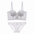 Detail of white lace lingerie set with longline floral embroidery bra and matching briefs - White + Briefs