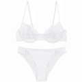 Detailed view of the intricate white floral lace and scalloped edges on the bra and panty - S / White