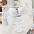 Flat lay of white mesh lingerie set with push-up bra and sheer panties on soft background - 75B / White