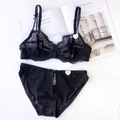 Elegantes schwarzes Spitzen-Dessous-Set mit Schleifendetails und Mesh in Flachansicht - 70A / Schwarz