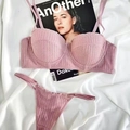 Elegant pale pink lace lingerie set with underwire bra and matching thong on white fabric - Pink