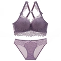 Purple lace lingerie set featuring floral embroidery and cross-back bra with matching briefs - Purple