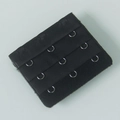 Detail view of black 3-row bra extender with durable stainless steel metal hooks - One Size / Black