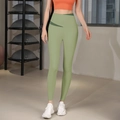 High-waisted sage green yoga pants featuring a V-shaped crossover waistband for shaping - S / Green
