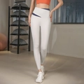 High-waisted light grey yoga leggings with unique crisscross waistband and blue contrast - S / Elegant Grey