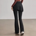 Schwarze Yoga-Schlaghose mit hoher Taille und unregelmäßigem Rock-Design zur Hüftbedeckung - S / Schwarz