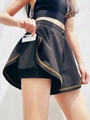 Falda pantalón deportiva negra 2 en 1 para mujer con bolsillo interior y costuras en contraste - S / Negro