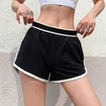 Pantaloncini da corsa larghi da donna con fodera interna e profili bianchi a contrasto - Nero
