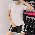 Top deportivo gris claro de media cremallera y pantalones cortos negros de mujer - S / Blanco Roto