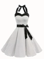 Dettaglio dell'abito bianco a pois con scollo all'americana e fiocco nero in vita - S / Bianco