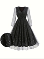 Détail des manches en tulle et du tissu scintillant de la robe noire avec col en V - S / Noir