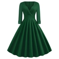 Dettaglio dell'abito vintage linea A verde scuro con scollo a V e vita alta definita - S / Verde