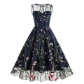 Close-up of intricate floral embroidery and sheer mesh neckline on this vintage navy dress - S / Blue