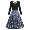 Detail of Christmas dress with V-neck and reindeer, candy cane, and snowflake patterns - S / Blue