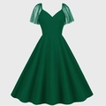 Vintage dark green Hepburn dress with polka dot mesh sleeves and flared A-line skirt - S / Dark Green