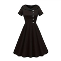 Close-up of retro black A-line dress featuring a wrap collar and white contrast buttons - S / Black