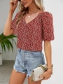 Detail of red floral V-neck blouse featuring puff sleeves and breathable summer fabric - XS / Red 1