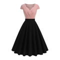 Detail of vintage V-neck patchwork dress featuring pink short sleeve top and black A-line skirt - S / Pink