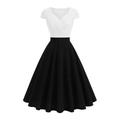 Detail of elegant black and white V-neck dress featuring contrast patchwork and A-line hem - S / White