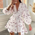 Close-up of white floral mini dress featuring V-neckline with delicate lace trim - White Floral