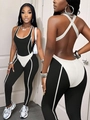 Rückenfreier Yoga-Jumpsuit für Damen in stilvollem Schwarz-Weiß-Kontrast-Design - S / Schwarz Weiß