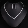 Elegant silver-tone rhinestone jewelry set with V-shaped necklace and matching drop earrings - Necklace + Earrings Set / White