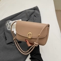 Chic light khaki leather shoulder bag with gold horseshoe buckle and drawstring strap - Khaki