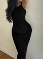Detail of black knitted bodycon dress showing vertical wave texture and elastic fabric - S / Black